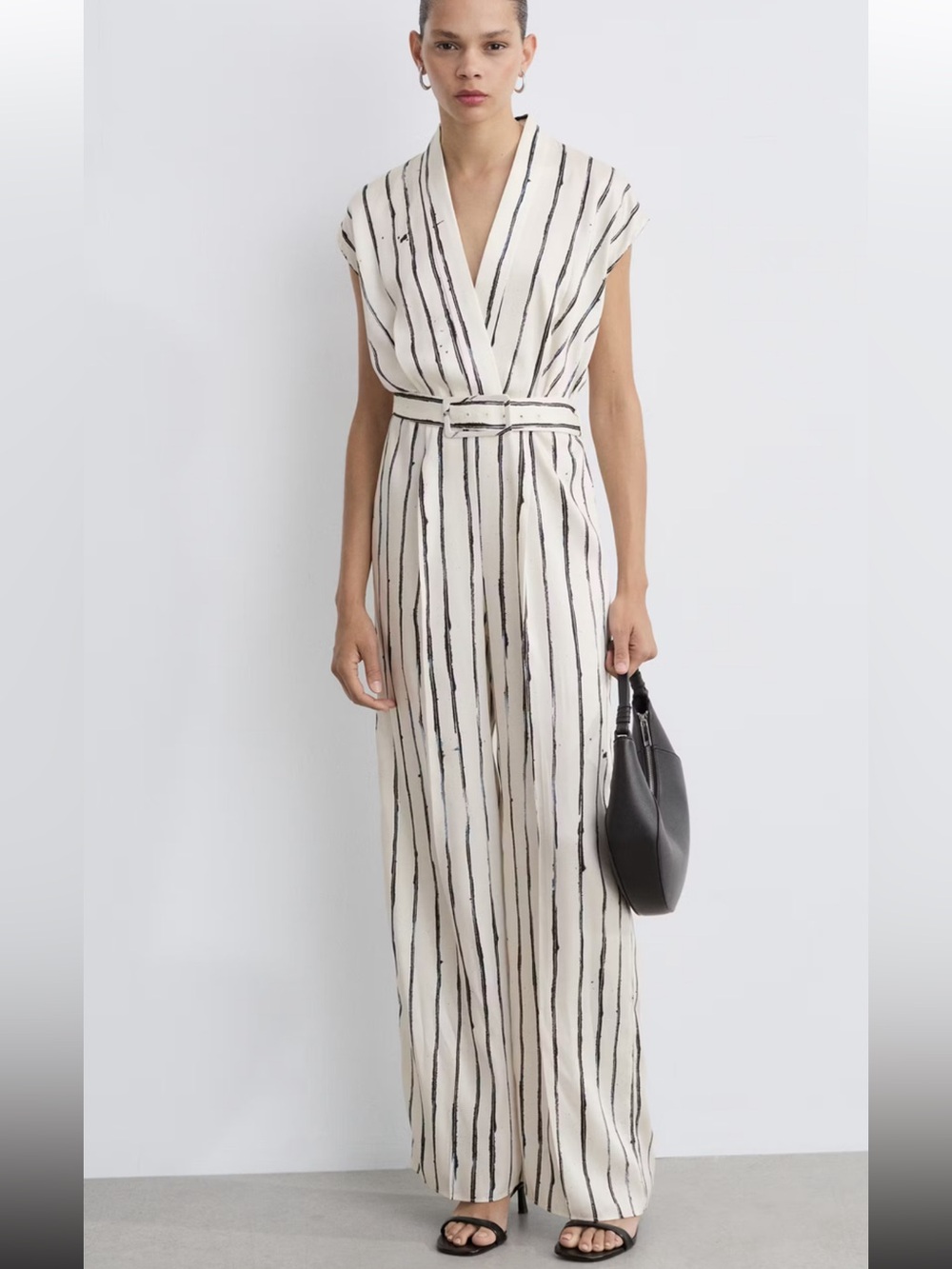 Mango Cream Jumpsuit with Black Vertical Stripes.